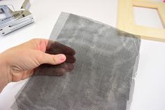 a person is making a piece of fabric