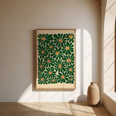 a vase sitting in front of a painting on the wall next to a white wall