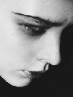 a black and white photo of a woman's face