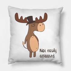 a white pillow with a moose wearing a hat and saying not easily amosed