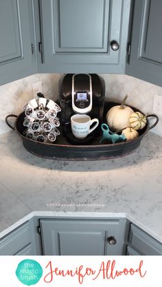 a tray filled with coffee cups sitting on top of a counter