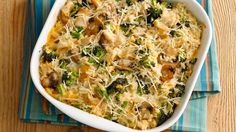 a casserole dish with broccoli, mushrooms and cheese