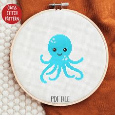 a cross stitch pattern with an octopus on it's face and the words, poi file