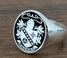 WELCOME TO CUSTOMRING BYELIF A family crest, emblem, or logo will be added to your bespoke signet ring to make it uniquely yours. It is genuine 925 sterling silver and unisex. The rings can be gold filled with 24k gold. Name engravings are one option for vintage bespoke signet rings. It makes the ideal gift for family members who appreciate antique jewelry and vintage rings. Create your own unique ring, and solid gold alternatives can include a family crest. PRODUCTS IN INVENTORY Sterling Silver Family Signet Ring, Christmas Ring, Womens Ring, Signet Rings, Dragon Jewelry, Ring Mens, Mens Ring, Solid Gold Rings, Unique Ring