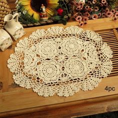 the table is covered with crochet doily