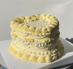 a white cake sitting on top of a table