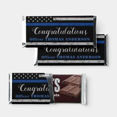 three chocolate bars with congratulations written on them