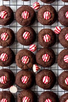 chocolate cookies decorated with candy canes on a cooling rack, ready to be eaten