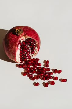 the pomegranate has been cut open and is ready to be eaten