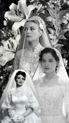 two women in wedding gowns standing next to each other and one woman wearing a veil