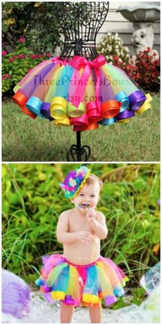 a baby wearing a colorful tutu skirt and matching headband