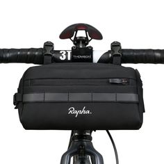 the handlebar bag is attached to the front of a bicycle