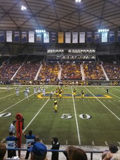 a football game is being played in an empty stadium