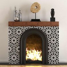 a fireplace with an ornate design on the mantle