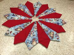 a red and blue christmas ornament sitting on top of a counter