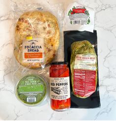 an assortment of food items sitting on top of a counter