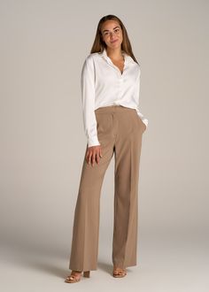 About Our Flat Front Wide Leg Dress Pants for Tall Women Ultra-flattering and easy to wear, these women's tall dress pants are a closet essential. They feature a smooth front with a contoured waistband for a complimentary finish. Pleated accents at the front and back elongate your legs and make them easy to wear from the desk to dinner. Built with a stretch-infused polyester-viscose blend, these pants for tall women offer the sleek feel of a suit with the comfort of a lounge pant. An elastic at Tan Dress Pants Outfit, Navy Blue Trousers Outfit, Blue Trousers Outfit, Pants For Tall Women, Dress Slacks For Women, Slacks Outfit, Formal Pants Women, Dress Pants Outfits, Meeting Outfit