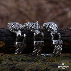 In the realm of Norse mythology, where legends are forged in steel and courage, our Legends of Ragnarök Bracelet Trio stands as a testament to the virtues of the gods. Jormungandr, the World Serpent, coils around the wrist, a reminder to face destiny with unyielding strength. Fenrir, the fierce wolf, breaks free from his chains, embodying the untamed spirit within. Hraesvelgr, the great eagle, soars above, granting the wearer a glimpse of the vast forces that shape our world. Crafted from premiu Silver Fantasy Bracelet, Adjustable Silver Fantasy Bracelet, Fenrir Thor Ragnarok, Fenrir Wolf Norse Mythology, Fenrir Offerings, The World Serpent, Fenrir Jewelry, Viking Style Silver Metal Bracelet, Viking Arm Rings