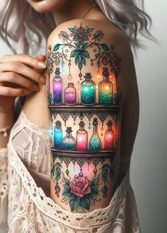 a woman's shoulder with bottles and flowers on it, all lit up by colored lights