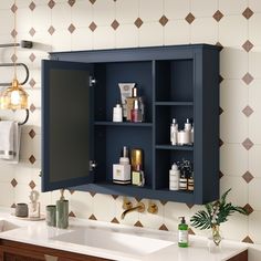 a bathroom with a blue cabinet and white counter top