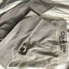 Brand New Condition W/O Tags Super Comfortable & Athletic Look More Gray In Photos But Is Very Light Tan Crme Color With Black Lines Designed Could Fit Smaller Than A Med (S) Fitted Khaki Bottoms For Loungewear, Fitted Taupe Bottoms For Loungewear, Athletic Looks, Creme Color, Black Lines, Performance Leggings, Light Tan, Womens Calvin Klein, Line Design