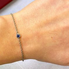 This 14k White Gold Bracelet Features A Delicate Chain With A Bezel Set Round Cut Blue Sapphire Charm. Tiny 15pt Natural Blue Sapphire. September Birthstone. Bracelet Length: Adjustable From 6.25-7.25. We Used The Finest Quality Materials And Utmost Care To Craft This Item And To Ensure Its Brilliance. Comes With Presentable Gift Box. Id: 049427 Yellow Gold Chain Bracelet With Bezel Setting, Elegant Blue Chain Bracelet As Gift, Elegant Blue Chain Bracelet For Gift, Blue Birthstone Bracelets In Fine Jewelry Style, Blue Birthstone Bracelets Fine Jewelry, Formal Birthstone Bracelets, Fine Jewelry Sterling Silver Diamond Bracelet With Bezel Setting, Classic Blue Diamond Bracelet As A Gift, White Gold Sapphire Bracelet As Gift