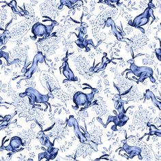 a blue and white wallpaper with rabbits on it