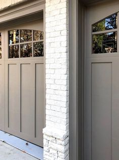 two garage doors on the side of a building