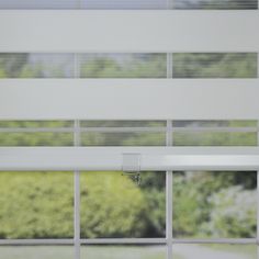 an open window with blinds on the outside