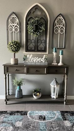 a table with some plants on it and a mirror above it that says mersey