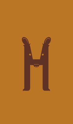 the letter m is made up of two large animals in brown and orange colors on an orange background