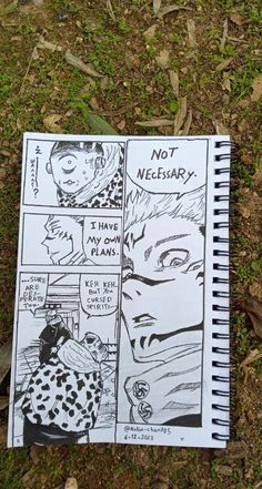 a comic strip is laying on the ground next to some leaves and grass, with an open notebook in front of it