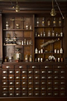 an old fashioned bar with lots of bottles on it