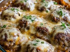 a casserole dish with meatballs and cheese