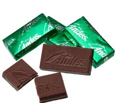 three pieces of chocolate sitting next to each other on a white surface with the word annie's printed on it