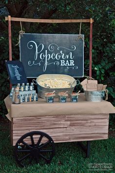 the popcorn bar is set up outside for an outdoor event