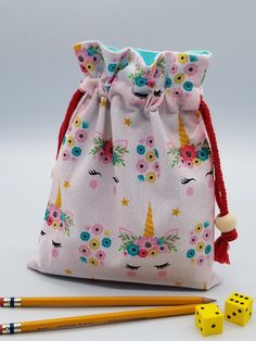 "🌻Premium quality made to order fabric bag. This drawstring bag is lightweight, strong, reusable, and washable. 🌻Made with double layer of 100% cotton fabric, outer layer is high quality printed fabric and lining inside with solid color fabric. 🌻Closure is macramé cord applied on both sides, make it easy to open and close. Decoration with wooden bead. 🌻 Available 5 sizes; XS = 4\"x6\", S = 6\"x8\", M = 7\"x9\", L = 9\"x12\", XL = 12\"x16\". 🌻 Multi-Purpose: Can be applied to store gifts, co Cheap Unicorn Print Bags For Daily Use, Playful Bags With Unicorn Print For Everyday Use, Cute Pink Unicorn Print Bags, Cute Bags With Unicorn Print, Cute Travel Bag With Unicorn Print, Toy Bags, Pink Unicorn, Macrame Cord, Fabric Gift Bags