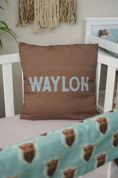 a brown pillow sitting on top of a white chair