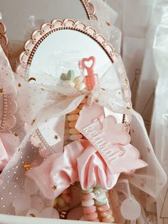 a basket filled with lots of pink and white items