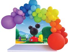 a mickey mouse balloon arch with colorful balloons