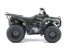 an atv with four wheelers parked in front of a white background and the words kawasaki on it