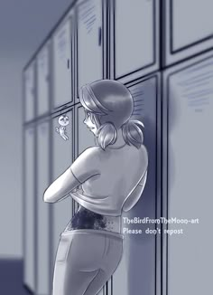 a woman standing in front of lockers with her back to the camera and looking at something