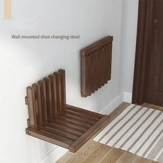 a wooden radiator sitting next to a wall mounted shoe changing stool