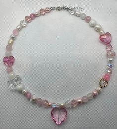 Handmade necklace Materials used: -glass crystal heart -glass beads -glass crystal beads -freshwater pearls Pink Crystal Heart Pendant Jewelry, Pink Crystal Heart Pendant Necklace, Pink Heart Cut Necklaces With Heart Beads, Pink Heart Beads Jewelry For Gift, Pink Necklaces With Heart Charm For Jewelry Making, Pink Crystal Necklaces For Mother's Day, Pink Crystal Necklace With Heart Charm, Pink Crystal Necklace For Mother's Day, Pink Crystal Jewelry For Mother's Day