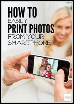 a woman holding up a smart phone to take a photo with her baby on the screen