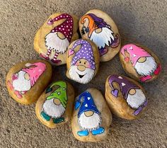 painted rocks with gnomes on them are arranged in a circle