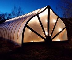 a large white building with lights on it's side