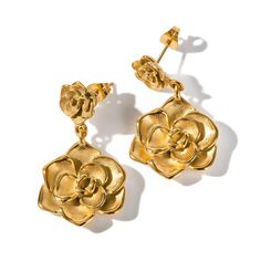 Bask in the radiant beauty of the Evelyn Earrings. These exquisite double drop earrings feature intricate floral designs, meticulously crafted from hypoallergenic and nickel-free stainless steel, plated with luxurious 18k gold using PVD technology for a lasting and brilliant shine. No matter the occasion, Evelyn earrings will elevate your style with their refined and trendsetting design. Double Drop Floral Design 18k PVD Gold Plated Stainless Steel Hypoallergenic & Nickel-Free Waterproof & Tarnish Resistant Weighs 15 Grams Luxury Gold Earrings With Intricate Design, Cheap Vintage Gold Flower Earrings, Luxury Rose Gold Tarnish-resistant Jewelry, Exquisite Luxury Gold-plated Earrings, Luxury Tarnish-resistant Drop Earrings, Luxury Hypoallergenic Rose Gold Earrings, Luxury Drop Earrings With Intricate Design, Luxury Tarnish Resistant Rose Gold Jewelry, Luxury Tarnish Resistant Drop Earrings