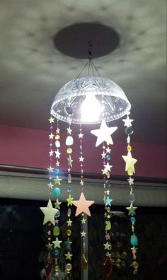 a chandelier with stars hanging from it