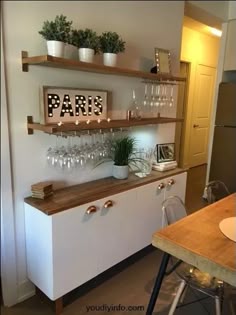 there is a wine glass rack in the kitchen